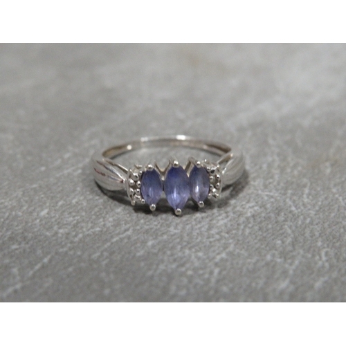 310 - A hallmarked 9 carat white gold Tanzanite and Diamond ring approx weight 2.2g ring size O½