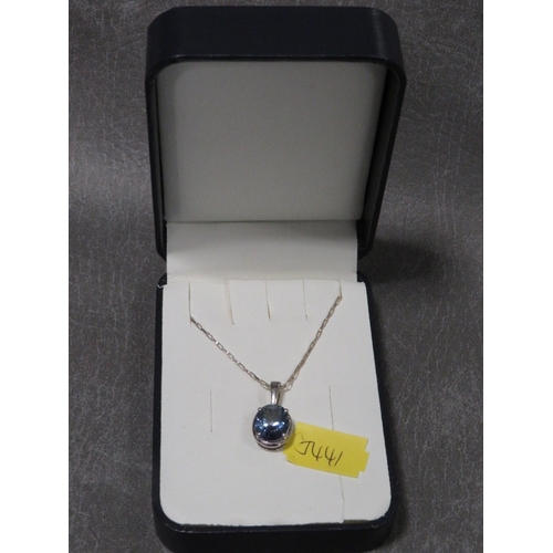 319 - A blue stone pendant on silver mount and chain