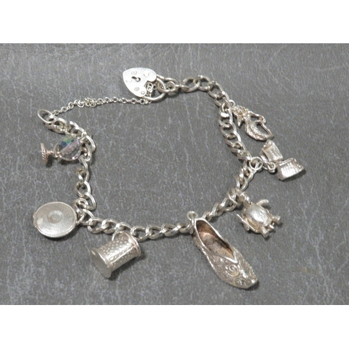 320 - A hallmarked silver charm bracelet approx weight 22.1g
