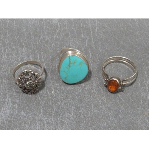 324 - Three dress rings to include a silver turquoise style example