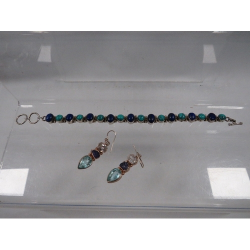 331 - A silver bracelet and silver earrings