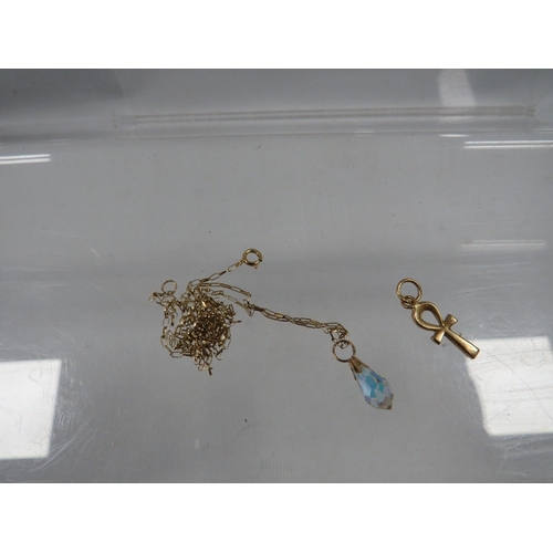 337 - A small yellow metal pendant together with a fine gold chain stamped 375