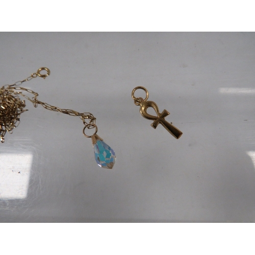 337 - A small yellow metal pendant together with a fine gold chain stamped 375