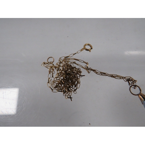 337 - A small yellow metal pendant together with a fine gold chain stamped 375