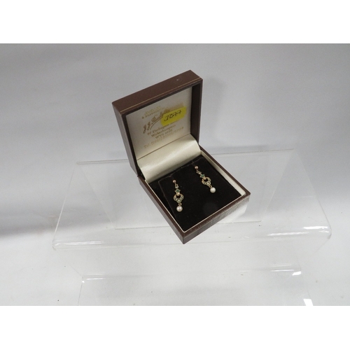 338 - A pair of hallmarked 9 carat gold vintage earrings set with seed pearls