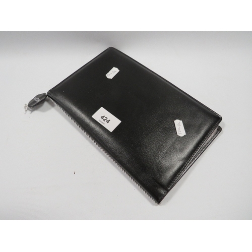 424 - An album of British ten shilling and one pound notes