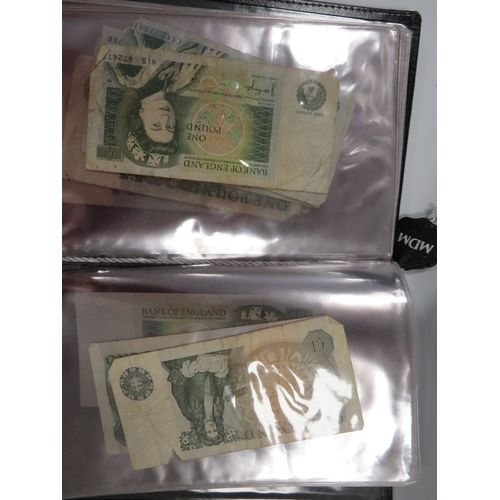 424 - An album of British ten shilling and one pound notes