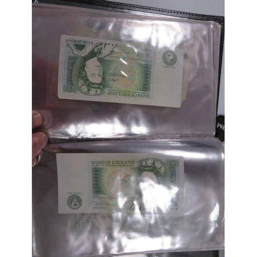 424 - An album of British ten shilling and one pound notes