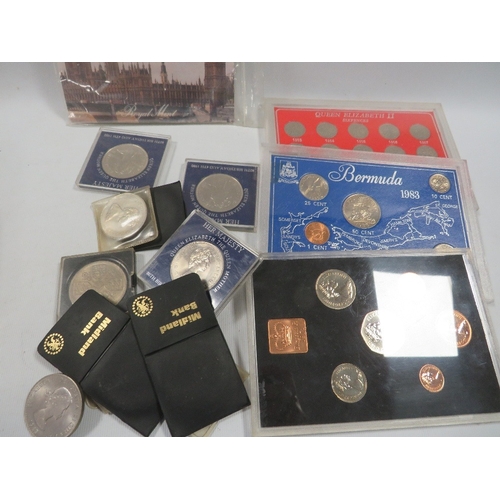 431 - A tin of assorted coin sets etc
