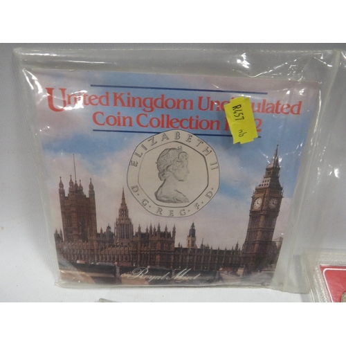 431 - A tin of assorted coin sets etc