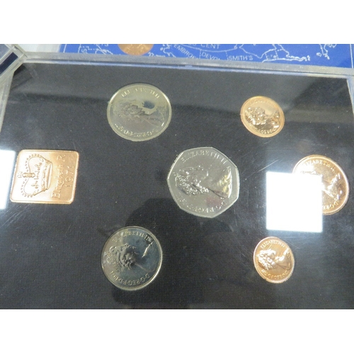 431 - A tin of assorted coin sets etc