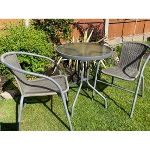 654 - A bistro patio table and chairs set