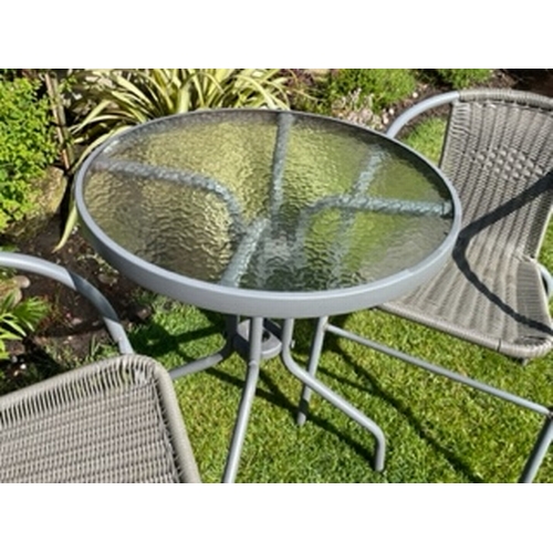 654 - A bistro patio table and chairs set