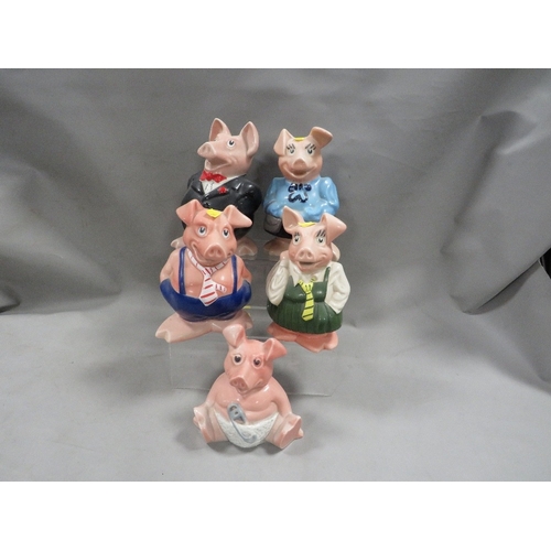 A set of five NatWest Wade piggy banks