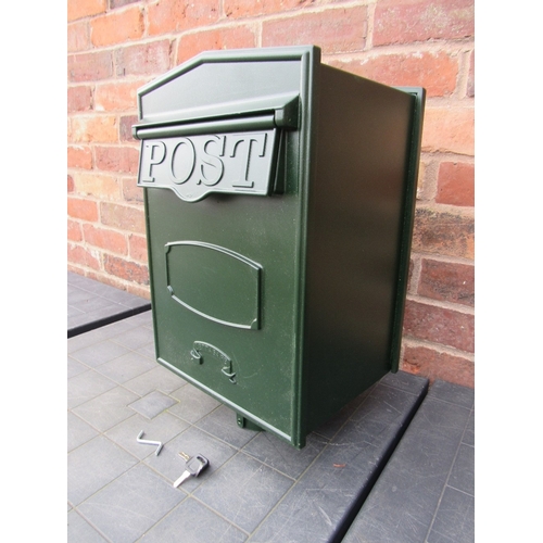 A green metal post box