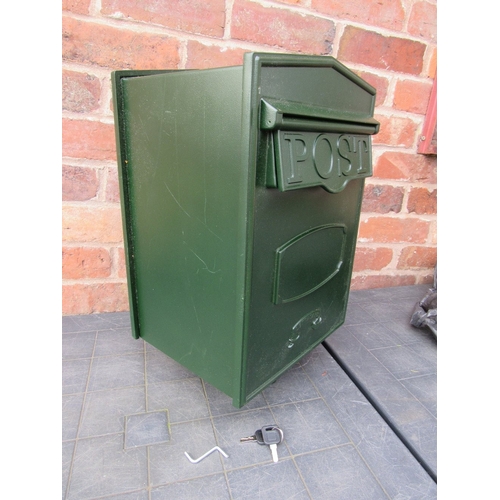 A green metal post box