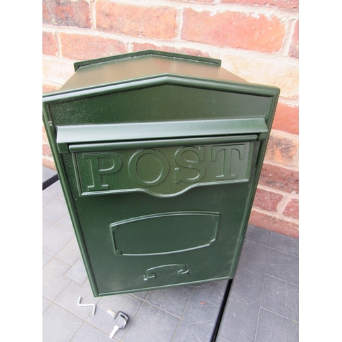 A green metal post box
