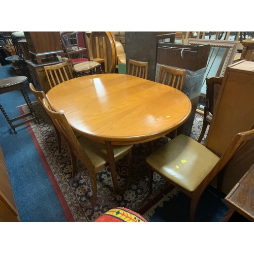 A mid century teak G-Plan dining table and six chairs