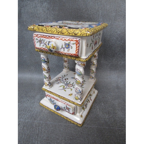 A QUIMPER DECORATIVE MINIATURE DECORATIVE CABINET, with two drawers, H 15 cm, W 9 cm, D 8 cm