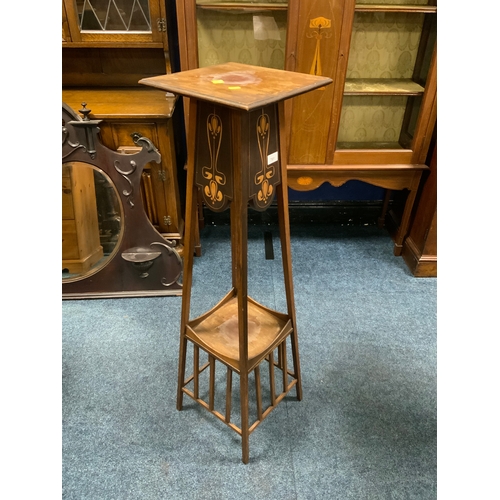 An Art Nouveau mahogany inlaid jardinière stand