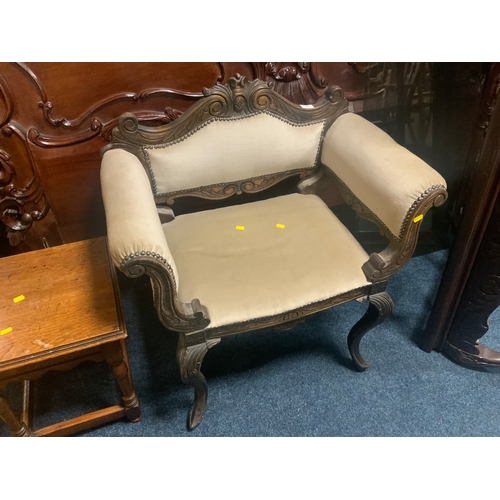 A modern upholstered carved armchair