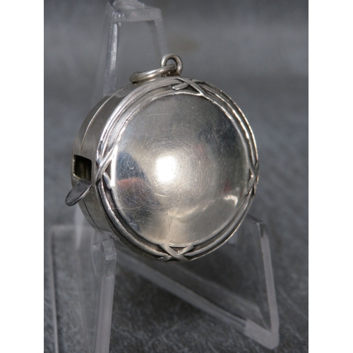 A SILVER TAPE MEASURE, marked 925, Dia. 2.5 cm