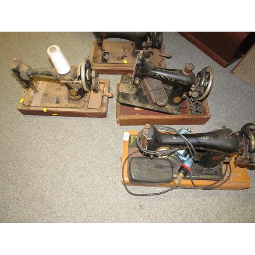 180 - Four vintage Singer sewing machines A/F