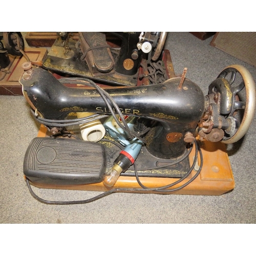 180 - Four vintage Singer sewing machines A/F