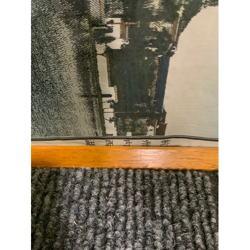 45 - A long silkwork depicting a lake scene possibly Japanese with characters to the end, 26 x 122 cm