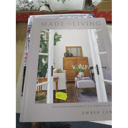 143 - Two trays of ex-showhome decorative items to include books, candlesticks etc