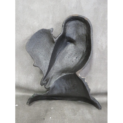 100 - **A cast metal doorstop in the form of an owl**