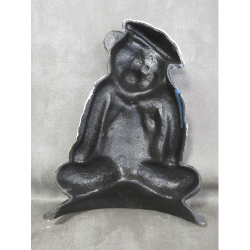 103 - **A cast metal doorstop in the form a a sailor bear**