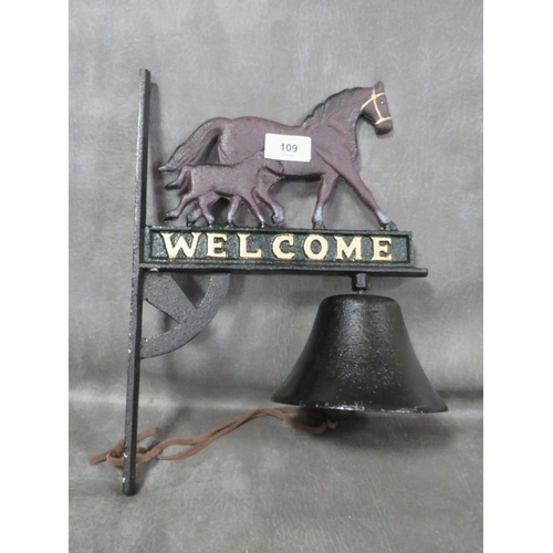 109 - **A cast metal Welcome sign mare & foal wall mounted bell**