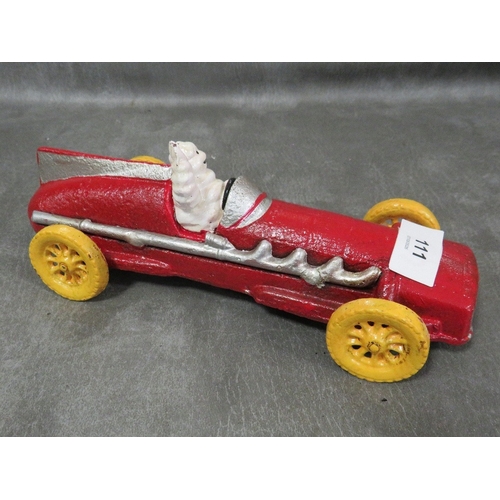 111 - **A cast metal model of a Michelin figure in vintage style red car**