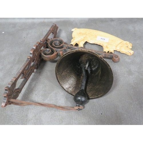 112 - **A cast metal wall hanging pig bell**