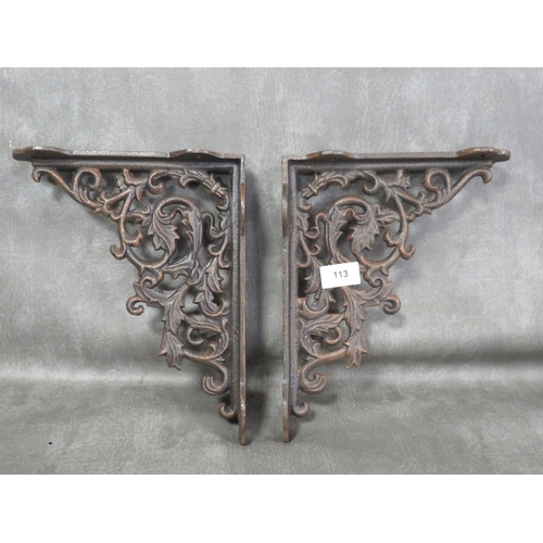 113 - **A pair of modern aged effect cast metal wall hanging brackets**