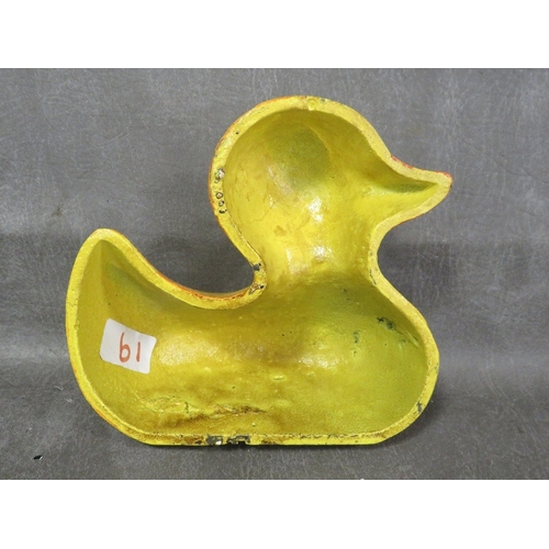 89 - **A doorstop in the form of a yellow duck**