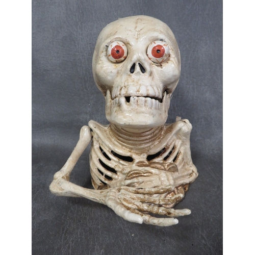 92 - **A cast metal skeleton money bank**