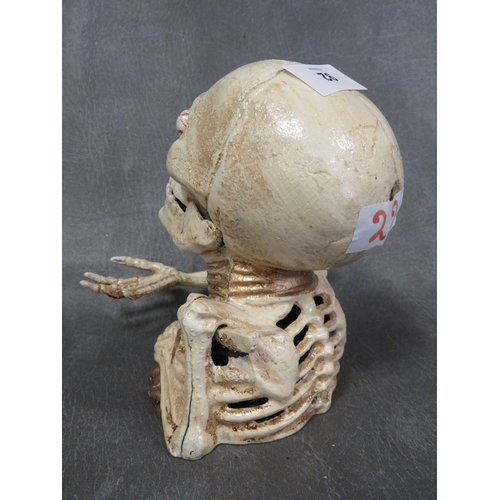 92 - **A cast metal skeleton money bank**