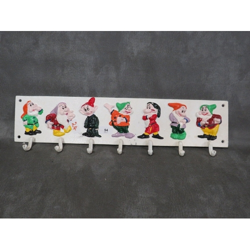 94 - **A cast metal Seven Dwarves style cup rack**