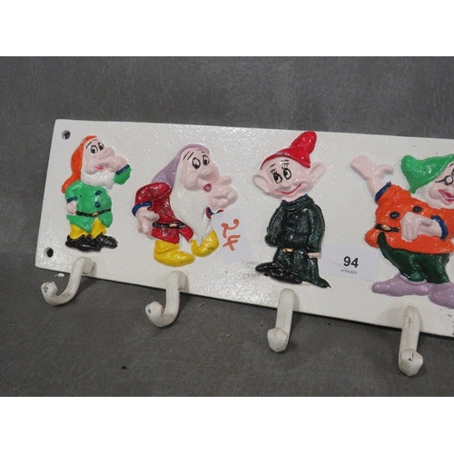 94 - **A cast metal Seven Dwarves style cup rack**