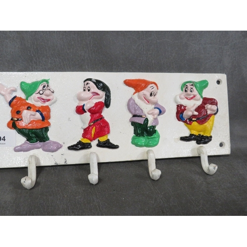 94 - **A cast metal Seven Dwarves style cup rack**