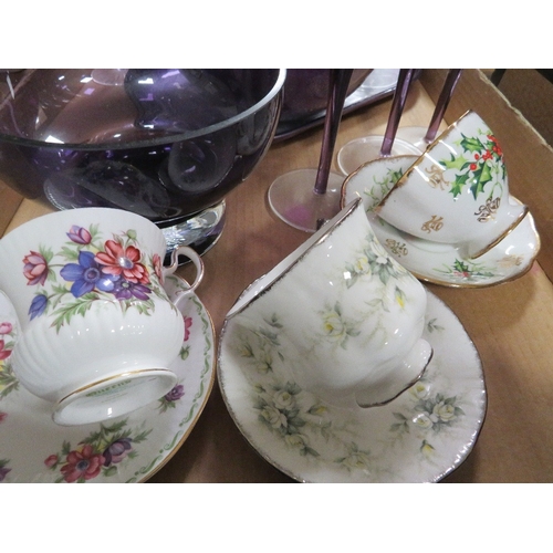 150 - A tray of assorted purple glass ware and ceramics