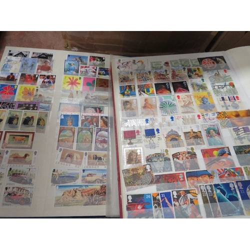 199 - Two trays of assorted stamp albums and contents