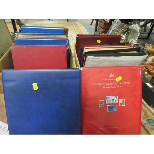 199 - Two trays of assorted stamp albums and contents