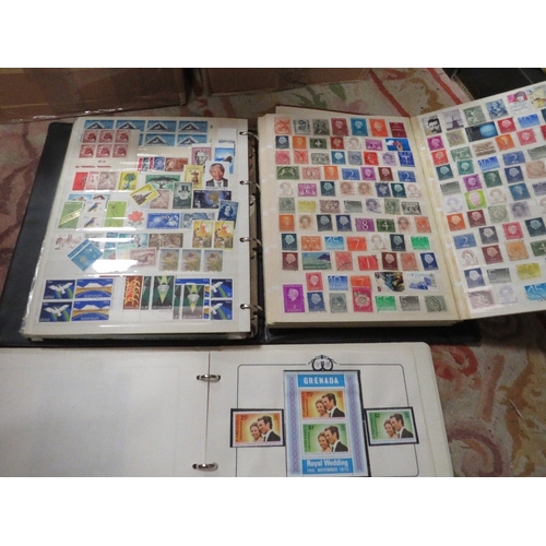 199 - Two trays of assorted stamp albums and contents