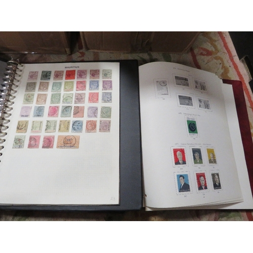 199 - Two trays of assorted stamp albums and contents