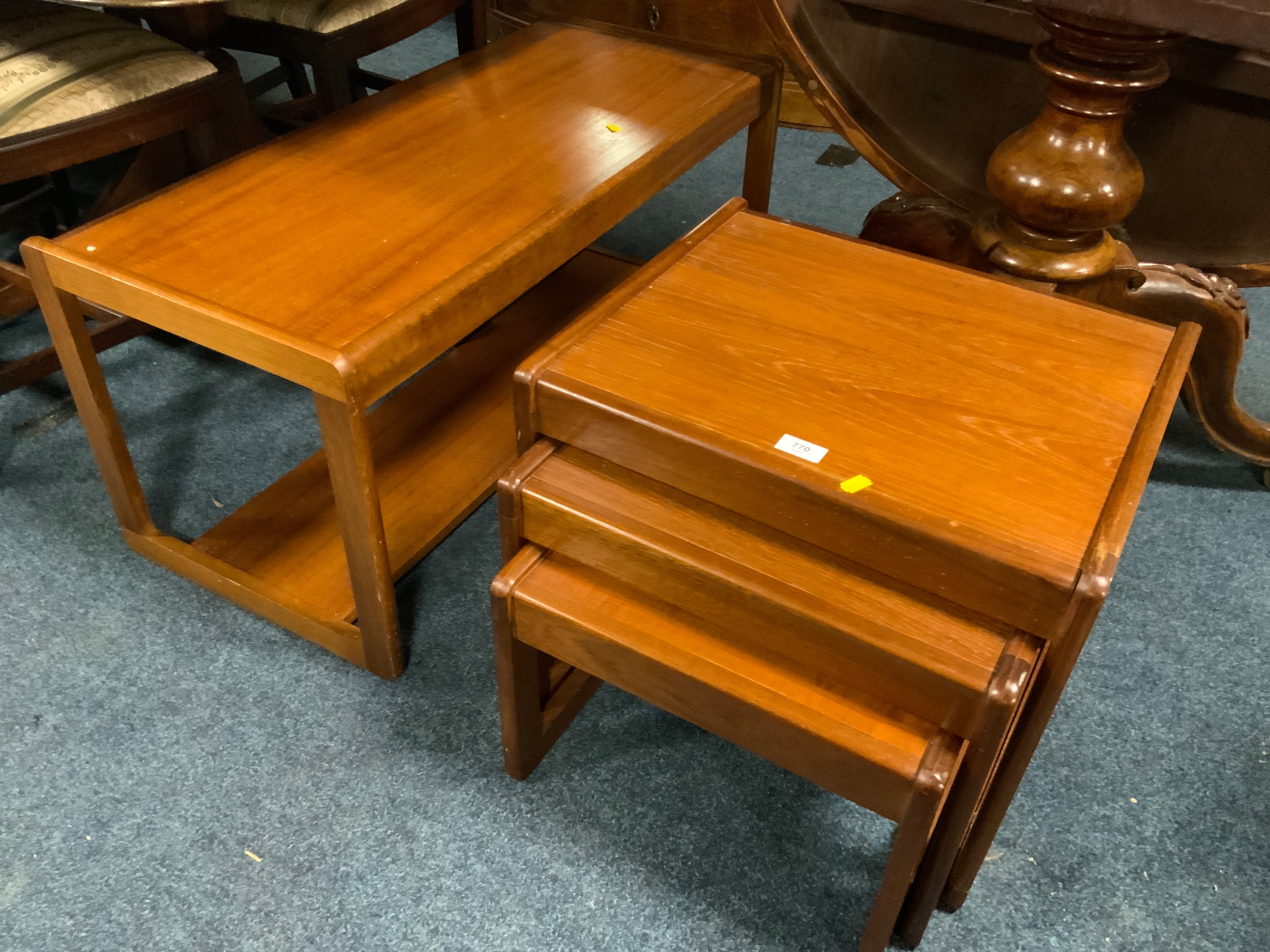 A mid-century ‘Sunelm’ nest of tables with a coffee table