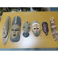 Six various African tribal art masks including one with cowrie shell eyes