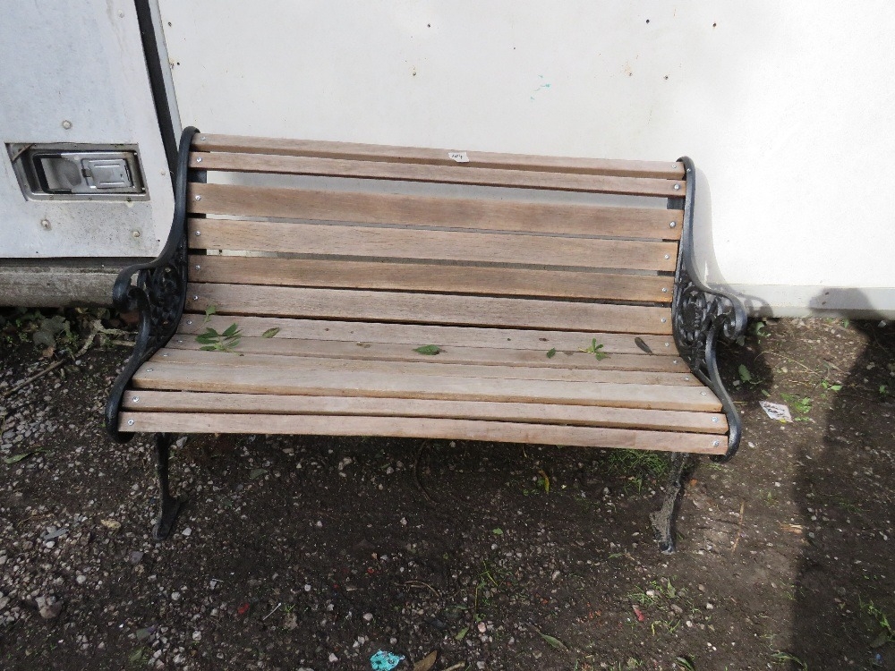 A cast iron and hardwood garden bench